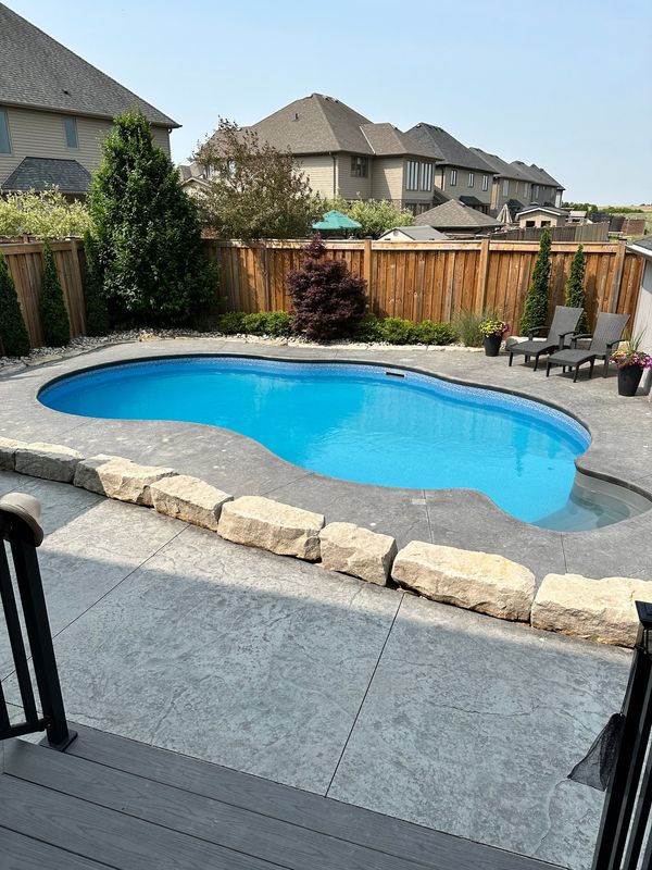 London Contracting swimming pool, concrete, landscaping and pool house installation.